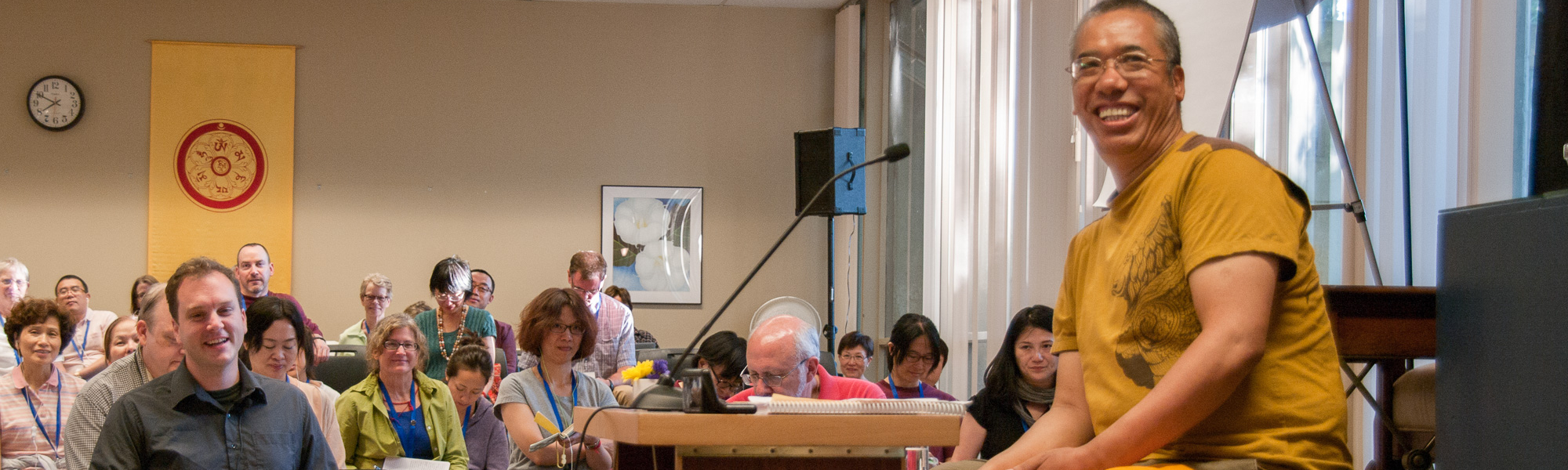 Acharya Lama Tenpa Gyaltsen, Buddhist teacher teaching Buddhist studies to a group of students.